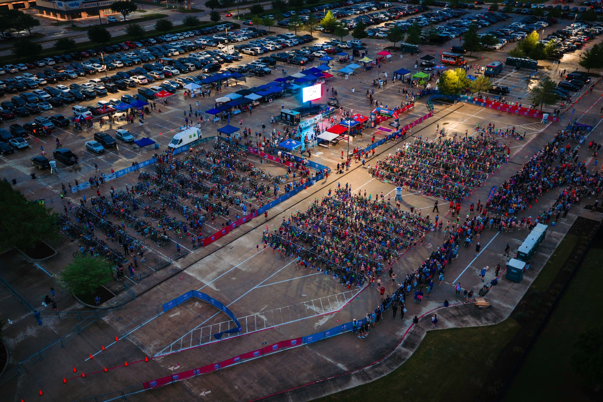 Young athletes running out of transition at the Houston Kids Tri