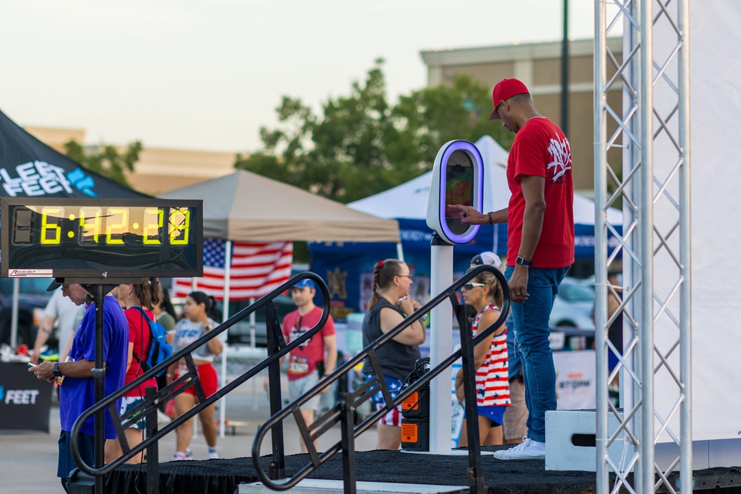 Crew member running the start line clock and display at a race