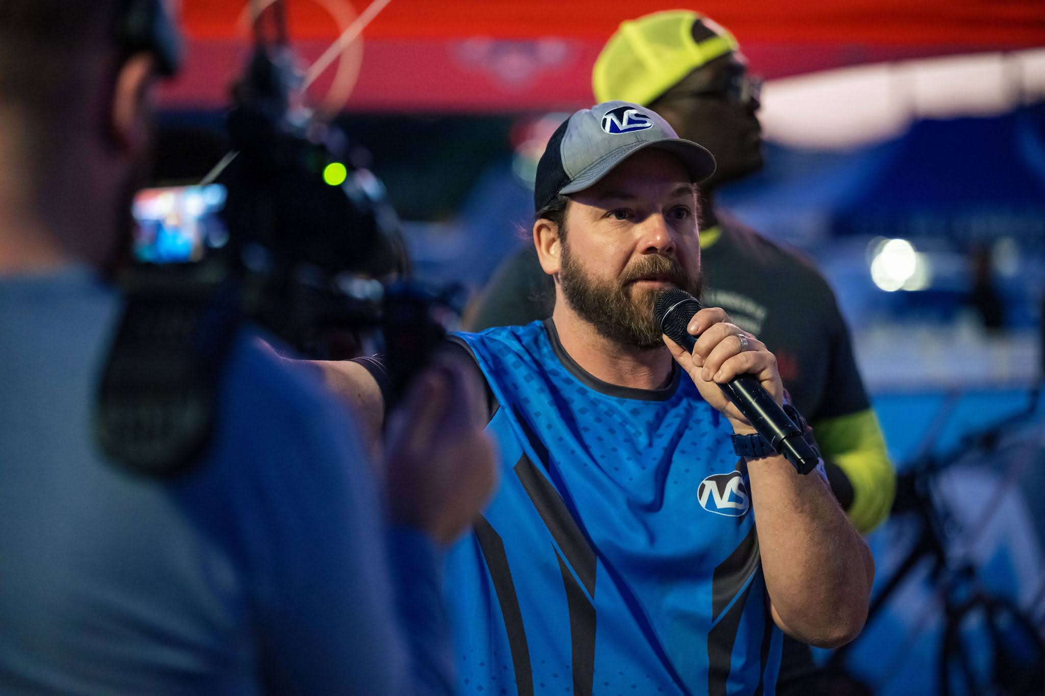 Tony Sapp on the mic at a finish line